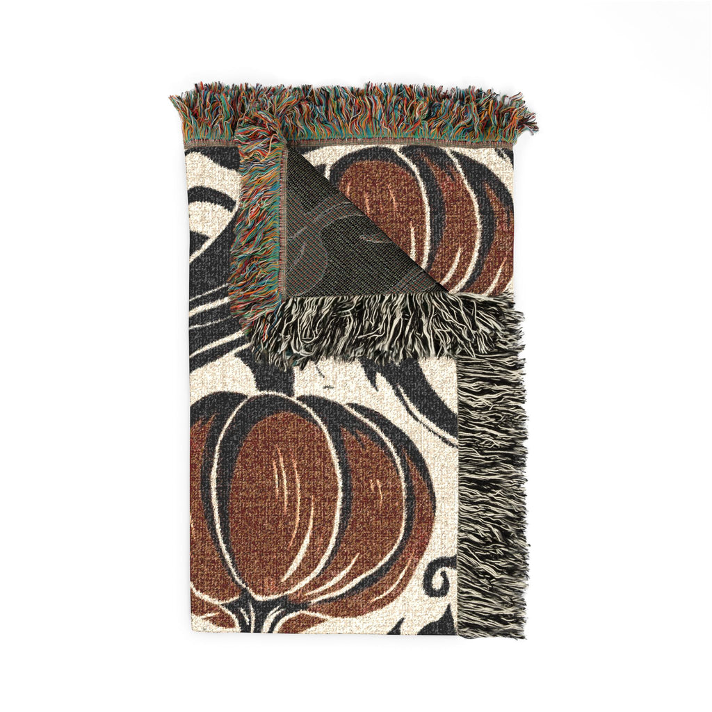 Folded gothic pumpkin blanket showing texture, reverse, and fringe