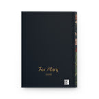 Personalized dark journal back cover with gold dedication, year, and production barcode