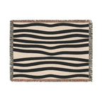 Modern zebra-inspired cotton throw with woven fringe