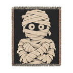 Front view of mummy woven throw blanket with colorful fringe