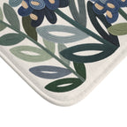 Close-up of the printed embroidery-look bluebonnet and wildflower design on the bath mat