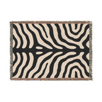 Black and cream zebra print woven throw blanket in a horizontal size