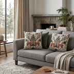 Pair of Christmas deer woven pillows on a gray sofa