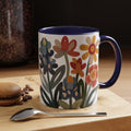 Retro floral accent mug with coral, mustard, navy, and blue flowers