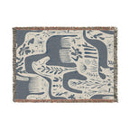 Blue and cream Scandinavian horse woven blanket with botanical folk-art pattern and fringe