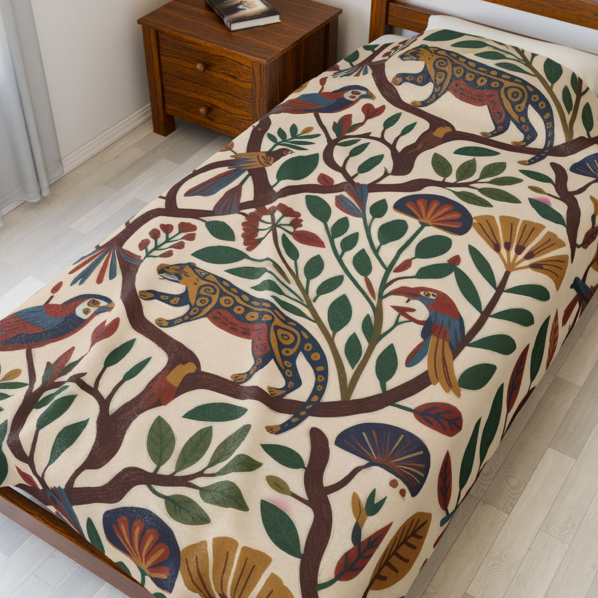 Jaguar, parrot, and floral plush blanket covering a bed