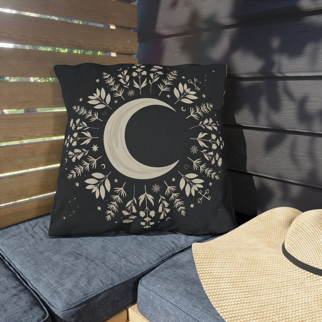 Black outdoor pillow with cream crescent moon and botanical mandala