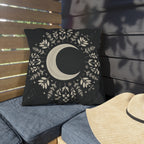 Black outdoor pillow with cream crescent moon and botanical mandala