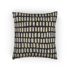 Black woven pillow with irregular cream dash grid pattern