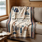 Custom cabin woven blanket displayed on a sofa beside a lake