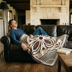 Black and rust Western floral medallion woven throw blanket shown at room scale