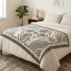 Black and rust woven blanket layered as Western home decor