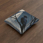 Ghost and raven woven Halloween pillow shown at an angle on a wood floor