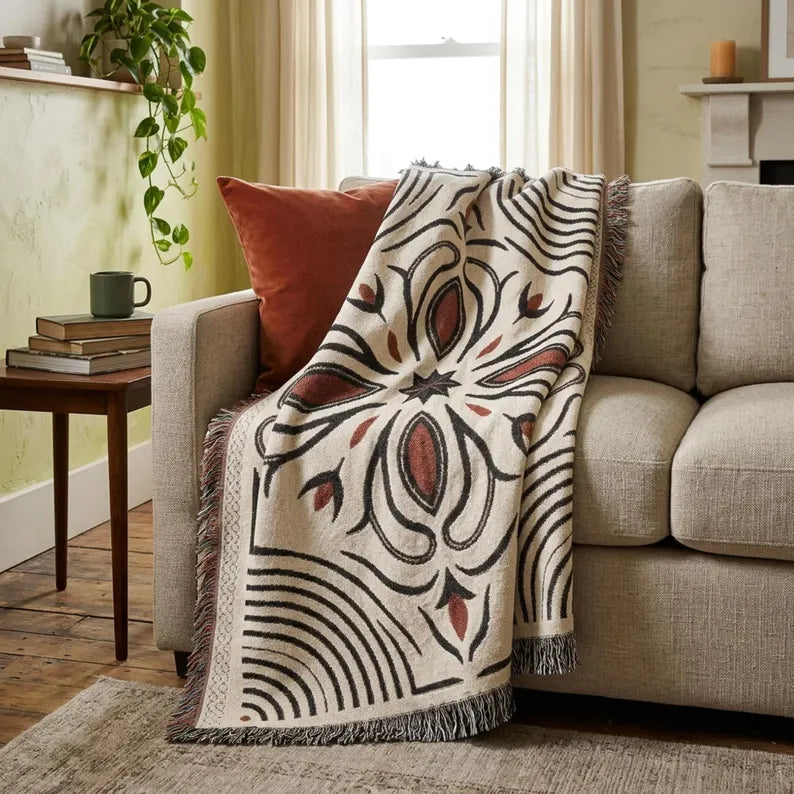 100% cotton Western woven throw blanket with fringed edges on a natural base