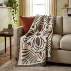 100% cotton Western woven throw blanket with fringed edges on a natural base