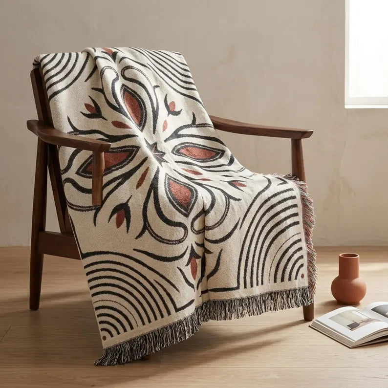 Made-to-order cotton woven blanket in a natural, black and rust boot stitch pattern