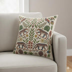 Jaguar and tropical bird folk art pillow styled on a white armchair