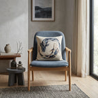 Japandi koi fish accent pillow on a blue chair in a serene neutral room