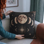 Person holding the 17 by 18 inch warm moon phases woven pillow for scale