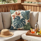 Green rust and teal monstera outdoor pillow artwork detail